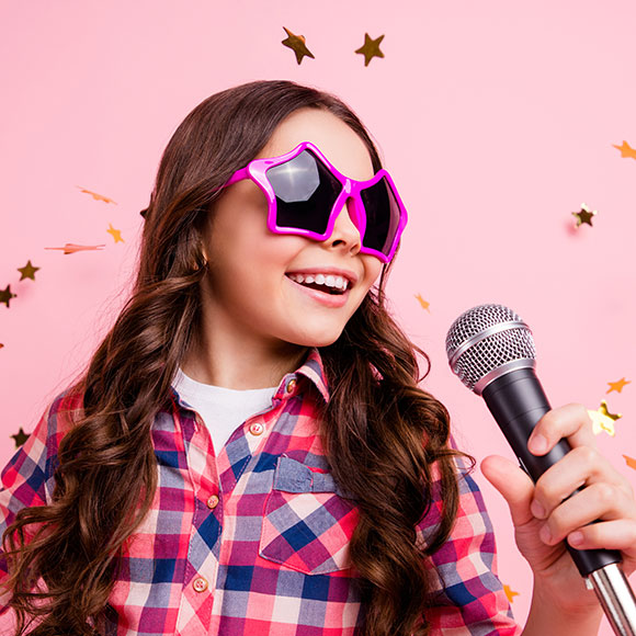 Close up photo of cool kid with microphone